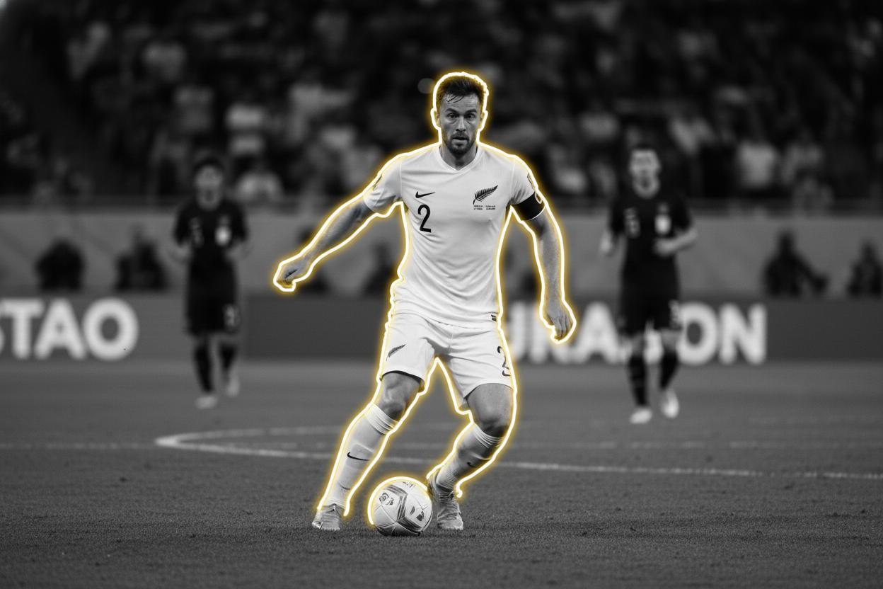 Tim Payne dribbling for New Zealand All Whites